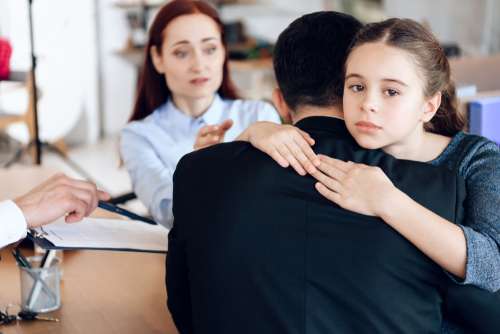 a girl child is hugging her dad -Appealing Child Custody in Alabama