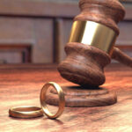 Gavel and wedding rings representing divorce process
