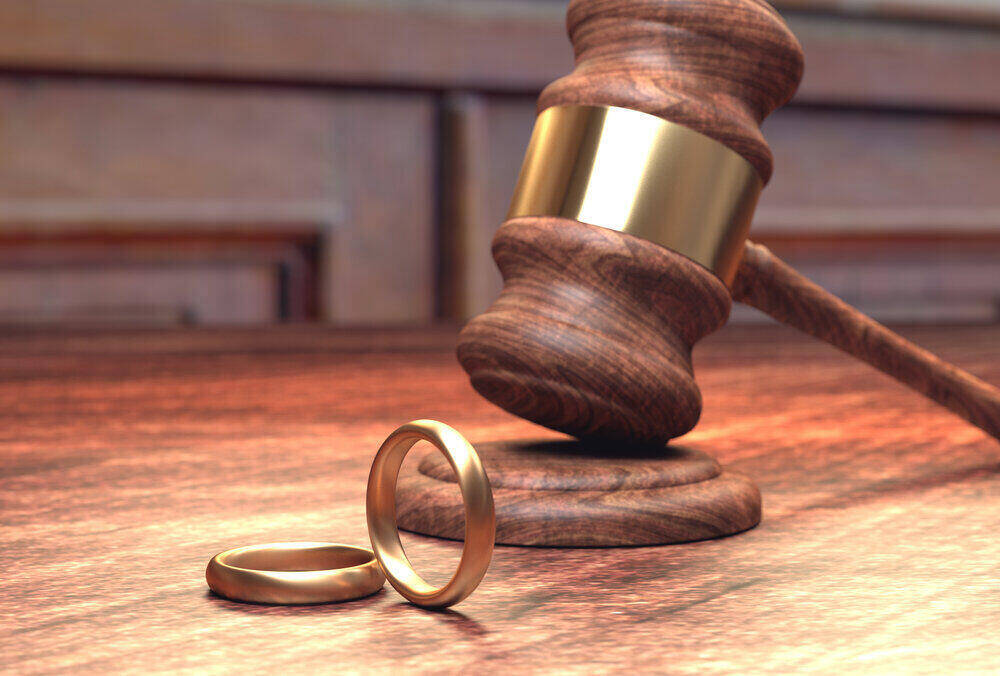 Gavel and wedding rings representing divorce process