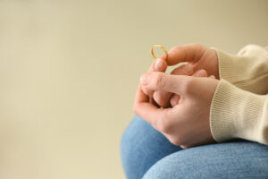 woman holding her wedding ring