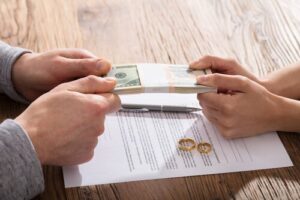 Divorce couple holding an alimony